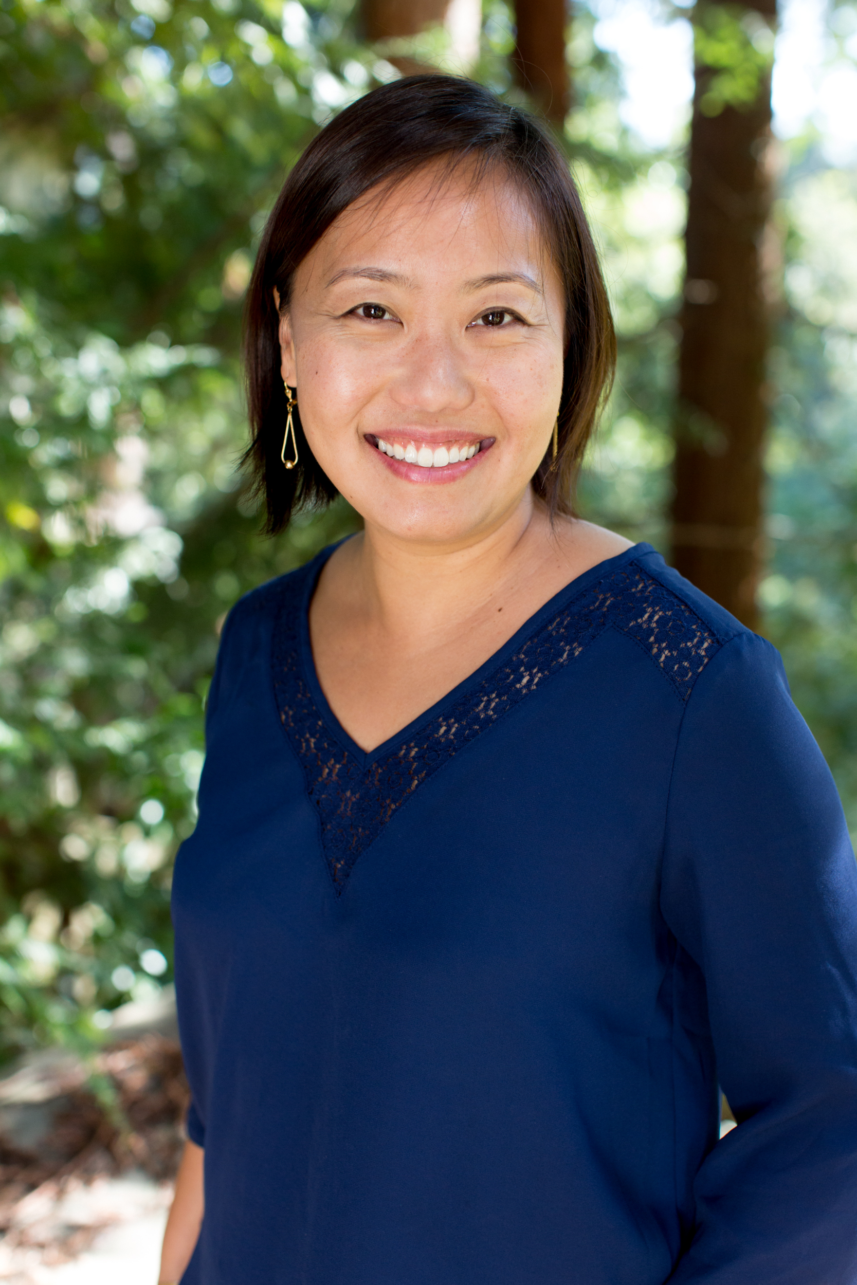 Photo of Yue-Ting Siu, standing with trees in the background